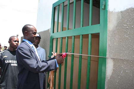 Lusaka Mayor Steven Chilatu  opening the new ablution block which was built recently for improved sanitation at Buseko market in Lusaka