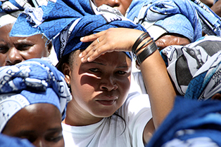 mmd-woman AN MMD cadre shades off the sunlight and following proceedings at State House