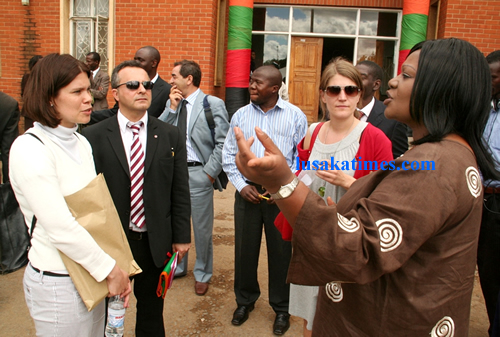 Lusaka district Commissioner Krista Kalulu talking to parliamentarians from Europe outside her office