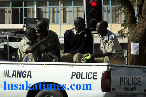 A van ferrying policemenr along Independence Avenue in Lusaka