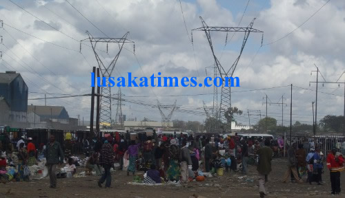 Business as usual  under Zesco high voltage lines behind Soweto market
