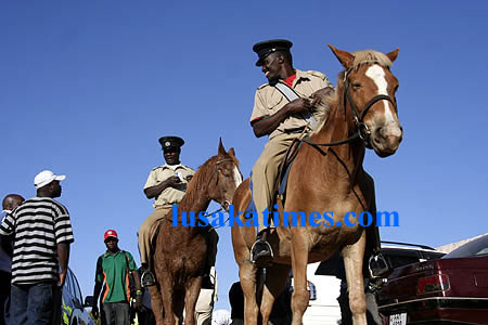 Horse back... Police men on horse back keep vigil at Nkoloma stadium
