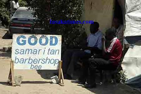 Waiting for customers...An entrepreneur waiting for people to come to his barbershop in Matero township.