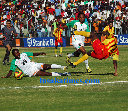 Zesco's Hichani Himoonde and El Merriekh's Lassana Fane fight for the ball during the Orange CAF champions league match at Nkoloma stadium. the teams drew 0-0