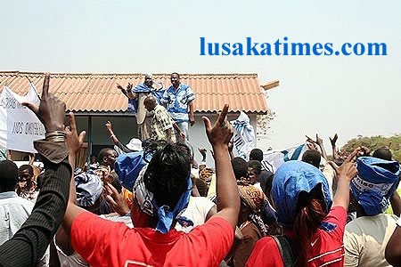 Supporters for MMD Kasama central candidate burton Mugala wave party slogan when he addressed them In Kasama