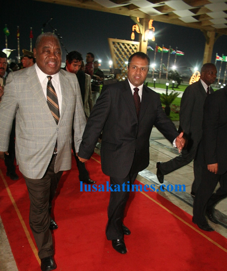 President Rupiah Banda walks abreast Libyan Secretary(Minister) of higher Education and scientific research Abdolkabir Alfalikry on arrival at Metiga Military Airport in Tripoli,Libya for the Special session of the African Union(AU) assembly on the consideration and resolution of conflicts in africa