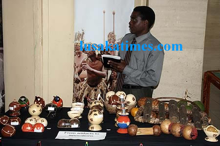 Mr Michael Mwandila displys his artifacts made from wild fruits and wood in Lusaka
