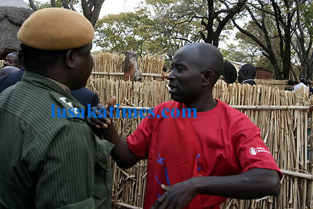 A guard blocks state security officer for President Banda from entering paramount chief Gawa Undi's palace before the Kulamba traditional ceremony in Katete