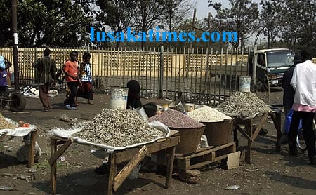 Marketeers selling dried food outside the Soweto market because they cannot access tradings places in the new market