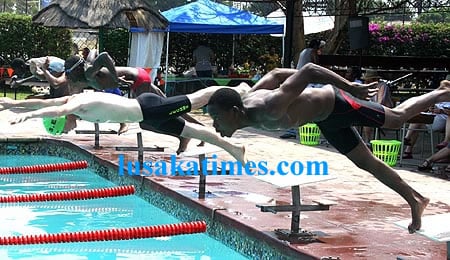 Young swimmers try to beat each other during the Zambia amtauer swimming union season opening gala at Lechwe school in Kitwe