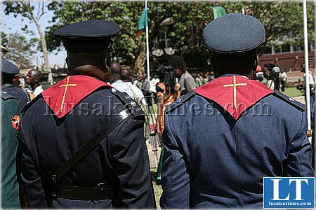 Chaplains from the defence forces follow proceedings after laying wreaths at the freedom staue in Lusaka
