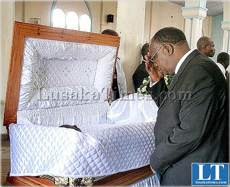 Chief Justice Ernest Sakala views the body of former State House press Aide John Musukuma during a requime mass in Lusaka