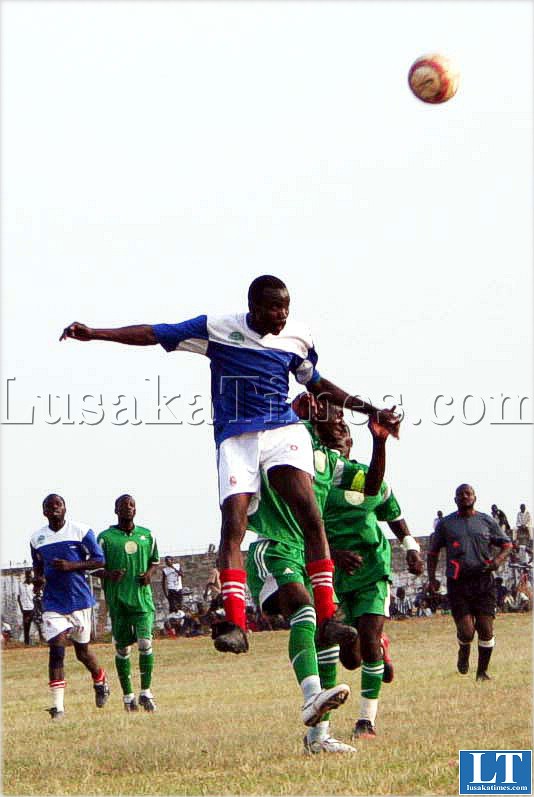 DAVIES Kunda of TAZARA Blue Stars players in an aerial tussle with Young Forest players at Kasama Sports Stadium. Young Forest beat TAZARA Blue  stars 2-0 in the FAZ division three qualifier match on Independence day in Kasama.
