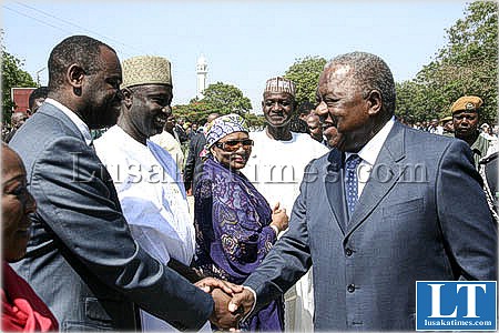 President Banda greets his son Dingani after laying wreaths at the freedom staue in Lusaka