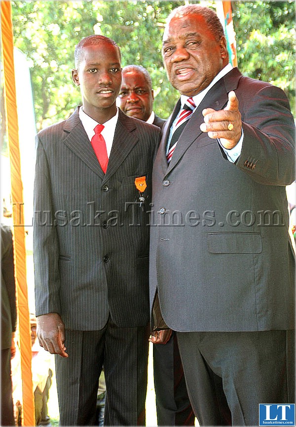 President Banda with Archwell Mawele after awarding him the President's Medal for Gallantry