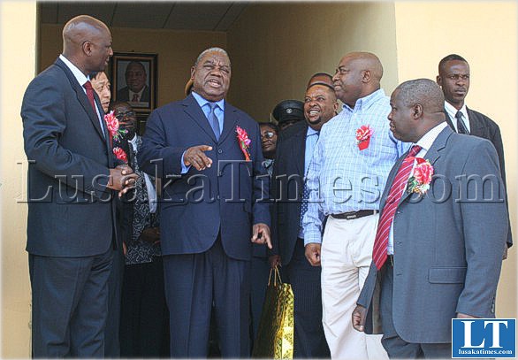 President Banda chats to Energy Minister Kenneth Konga (r), Acting Mines Minister Peter Daka and Zesco MD Cyprian Chitundu (l), after concluding a tour of the CNMC-Zesco power substation.