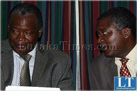 UPND member of parliemant for Monze central Jack Mwiimbu (l) listens to his counterpart for Siavonga Douglas Siakalima in the national assembly committee rooms