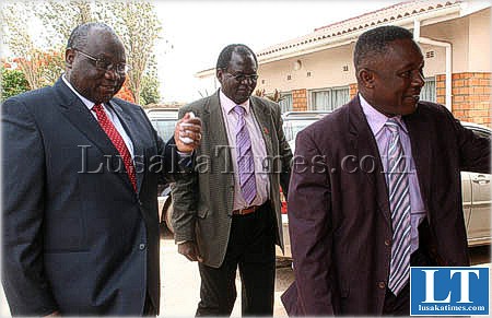 Zambia Meteorological Department director Maurice Muchinda (r)ushers Communications and Transport Minister Geoffrey Lungwangwa for a seminar on weather focusing in Lusaka