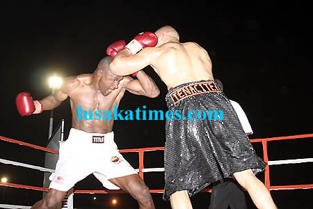 Zambia's charles Wasaja' Chisamba and Tunisia's Faisal Arrami exchange blows during the African Boxing Union fight in Lusaka. Arrami won by knock knock
