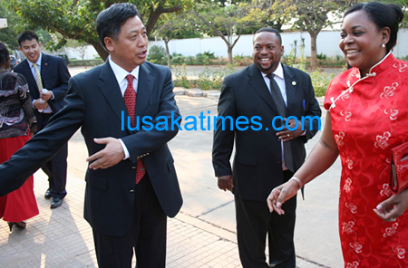 Chinese Ambassador to Zambia Li Quiangmin ushers Lands minister Peter Daka and former First Lady Maureen Mwanawasa for the Chinese national national day in Lusaka