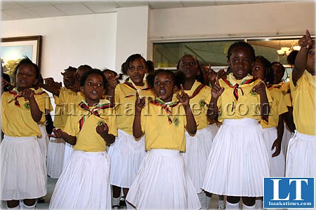 Members of the Girl Guides Association of Zambia singing before the investiture and badging ceremony in Lusaka