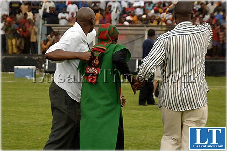 Security personnel dragging a pitch evader out of Nkoloma stadium during the Barclays cup final match between Power dynamos and Green Buffaloes Security personnel dragging a pitch evader out of Nkoloma stadium during the Barclays cup final match between Power dynamos and Green Buffaloes