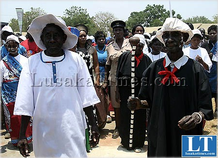 Village elders lead other guests into the main arena for the Chakwela Makumbi traditional ceremony in Chongwe