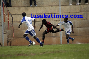 Zanaco's Ignatius Lwipa tries to beat defenders from Chambishi during the FAZ-KCM rescheduled week 27 match played at Sunset stadium Lusaka. Zanaco won 4-1
