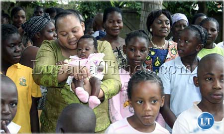 Mrs Nompumelelo Zuma and Thandiwe Banda interact with children at  Kabwata orphanage in Lusaka