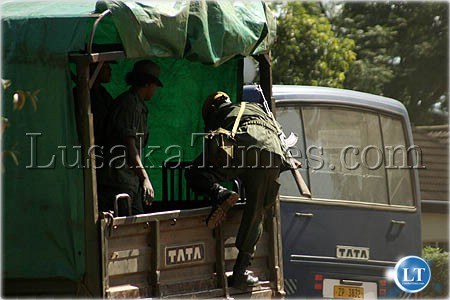 File:Police transportation...Female police officers disembark from a lorry after a one hour thirty minutes drive from Lusaka to Mazabuka