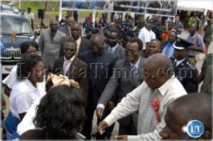 President Banda and vice president George Kunda give a monetary reward to MMD cadres for dancing at the production resumption ceremony at Luanshya Copper Mines. Copperbelt, Zambia