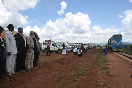From left: Eastern Province Minister, Isaac Banda, Zambia’s Deputy High Commissioner to Malawi, Paul Katema, Chipata/Mchinji railway project contractor, Ziaudin Daya and Malawi’s Central, East Africa Railways ( CEARs) Regional Manager, Lexon Kalanje, witness the arrival of the first train to Chipata near Chuni Village, six kilometers from Mwami border.