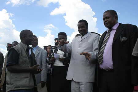 Eastern Province Minister, Isaac Banda, emphasizing a point to Chipata/Mchinji railway project engineer, Ernest Silwamba ( l ) and Zambia’s Deputy High Commissioner to Malawi, Paul Katema ( r ) as they waited for the arrival of the first train to Chipata. Looking on are Eastern Province Deputy Permanent Secretary ( second left) and his regional PS, Eularia Syamujaye