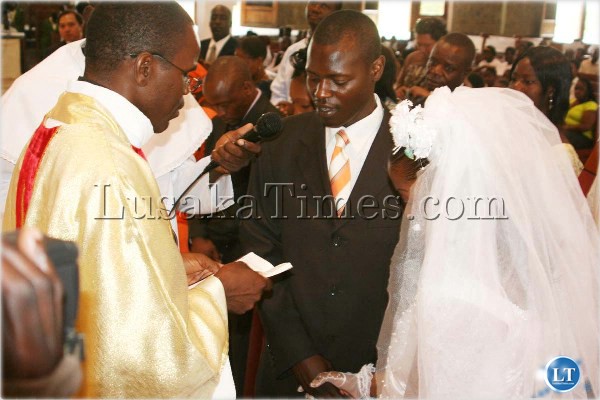 Five couples yesterday exchanged wedding vows during the morning mass at Cathedral of the Child Jesus Catholic parish in Lusaka. Above, some of the couples who’s marriages were blessed by Cathedral of the Child Jesus Parish Priest Father Sylvester Ngandu during the wedding ceremony. Five couples yesterday exchanged wedding vows during the morning mass at Cathedral of the Child Jesus Catholic parish in Lusaka. Above, some of the couples who’s marriages were blessed by Cathedral of the Child Jesus Parish Priest Father Sylvester Ngandu during the wedding ceremony.