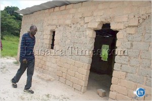 Deputy Minister in the Vice President's office Gunston Sichilima checking on one of the classroom blocks at Muchindushi basic school in Lukanga North resettlement scheme during his tour of government developmental projects in Mpongwe
