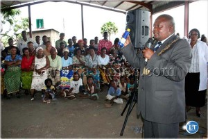 Lusaka Mayor Robert Chikwelete educates Lusaka residents on the use of chlorine when he re-launched the Keep Lusaka Clean campaign in Chaisa township
