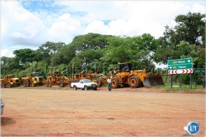 Sable Construction Company earth moving machines lined up before President Rupiah Banda officially flagged off the works of the tarring of the Chipata/Mfuwe road in Chipata