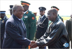 President Rupiah Banda bids farewell to presidential affairs Minister Ronald Mukuma before he left for Angola at Lusaka International Airport