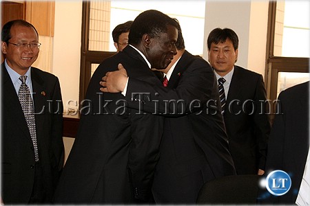 Mines minister Maxwell Mwale hugs investors in the mining sector from China Mines minister Maxwell Mwale hugs investors in the mining sector