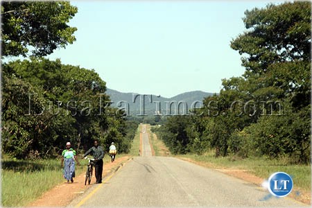 Villagers walking along the great east road to access services such as health and markets in eastern province