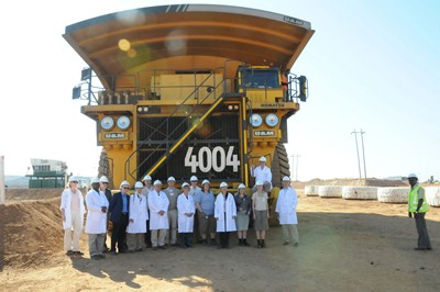 Members of the Foreign Affairs Committee of the Danish Parliament and officials from their Zambian embassy are dwarfed by giant 300-tonne Komatsu dump truck on their recent visit to the Chingola Open Pits operations of Konkola Copper Mines.