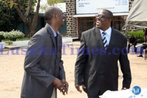 Western Province Permanent Secretary Seth Muleya chats with Bank of Zambia Head of Public Relations Kanguya Mayondi after the Donation of Mattresses to Kalabo high School at Western Provincial Education Office