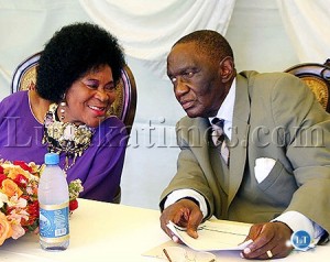 Princess Nakatindi Wina (l) talks to her husband Sikota Wina during a press briefing at their resident in Lusaka