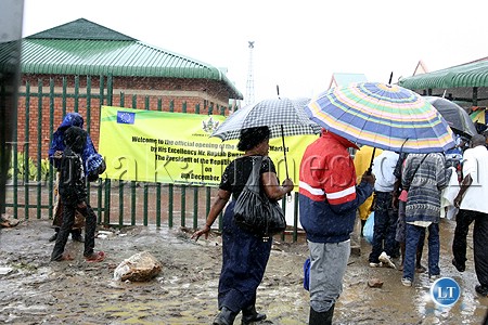 Marketeers brave the rain to go and witness the opening of Soweto market in Lusaka
