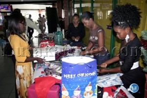 Some women entrepreneurs providing a christmas gift wraaping service at Arcades shopping centre in Lusaka