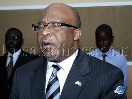 Zambia's High Commissioner to Canada Nevers Mumba in prayer at the Zambian diplomatic conference in Chisamba