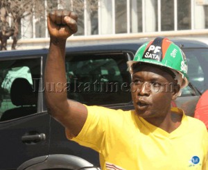 A Patriotic Front cadre celebrates his party's victory along president