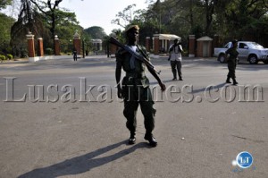 Police guard the main gate to State House to restrain Patrotic Front cadres who wanted to make their way into the premises