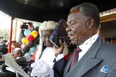 President Michael Sata takes the Oath of Office as Chief Justice Ernest Sakala looks on at the inauguration ceremony in Lusaka President Michael Sata takes the Oath of Office as Chief Justice Ernest Sakala looks on at the inauguration ceremony in Lusaka