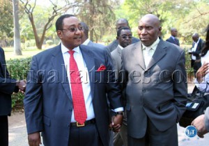 New appointed ministers Geoffrey Mwamba (left), for Defense and Kennedy Sakeni for Home Affairs walk hand-in-hand after the announcement of members of the new cabinet at State House.
